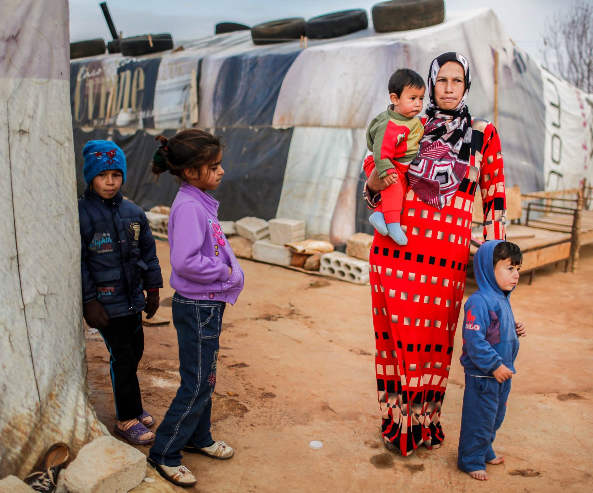 kids and mother at refugee camp Migrants and Refugees