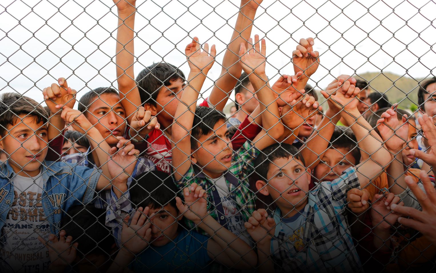 kids behind the fence Migrants and Refugees